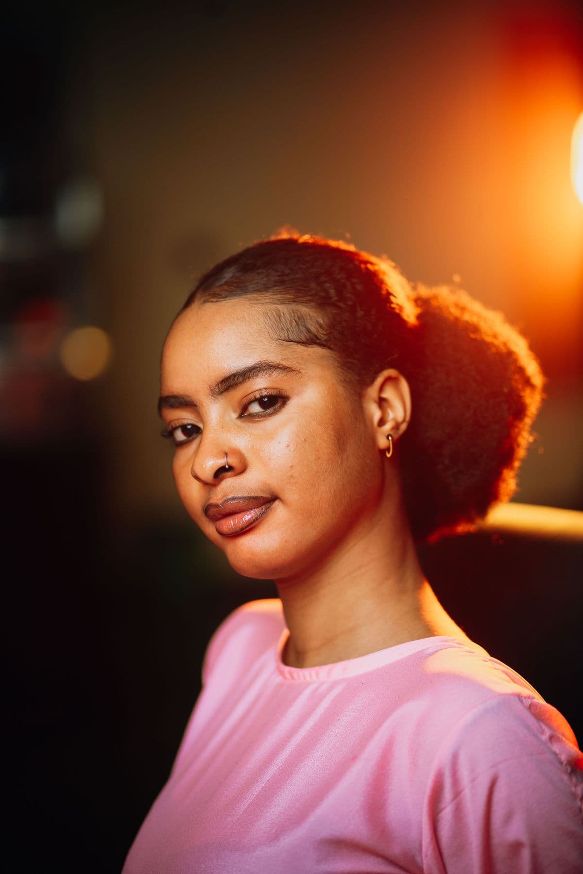 A woman with warm, glowing, healthy skin